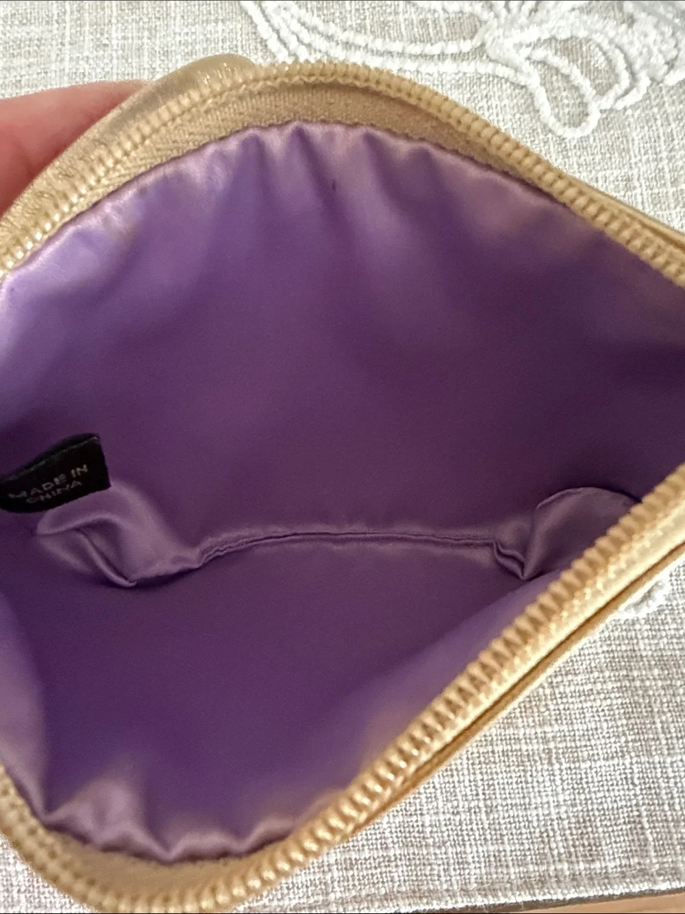 Coach Metallic Gold Wristlet with Embossed Chain Motif